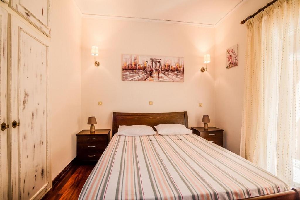 Posteľ alebo postele v izbe v ubytovaní Chara's House