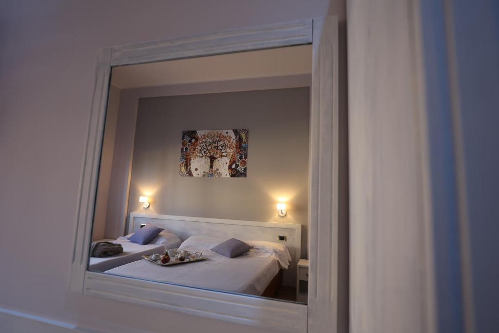 Postel nebo postele na pokoji v ubytování Grand Hotel Paradiso
