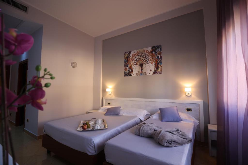 Postel nebo postele na pokoji v ubytování Grand Hotel Paradiso