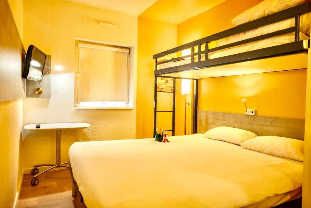 Postel nebo postele na pokoji v ubytování ibis Budget Colmar Centre Gare