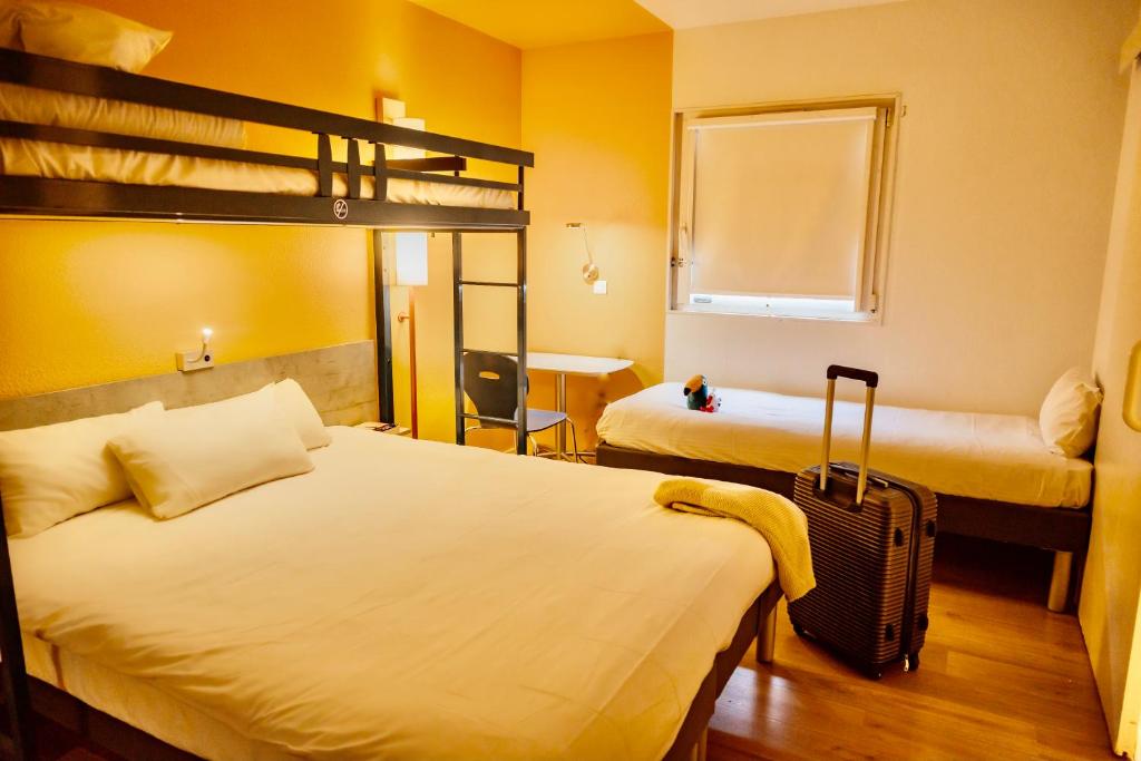 Postel nebo postele na pokoji v ubytování ibis Budget Colmar Centre Gare