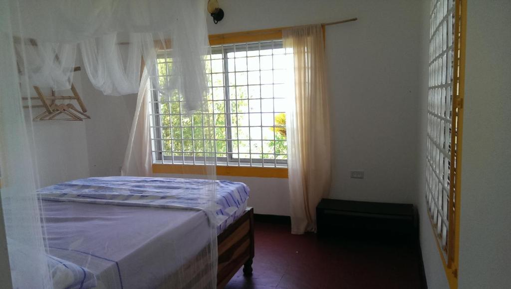 Postel nebo postele na pokoji v ubytování Germaican Hostel