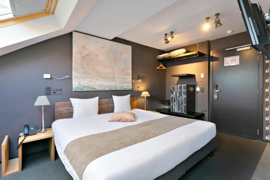 Postel nebo postele na pokoji v ubytování Boutique Hotel Saint-Géry