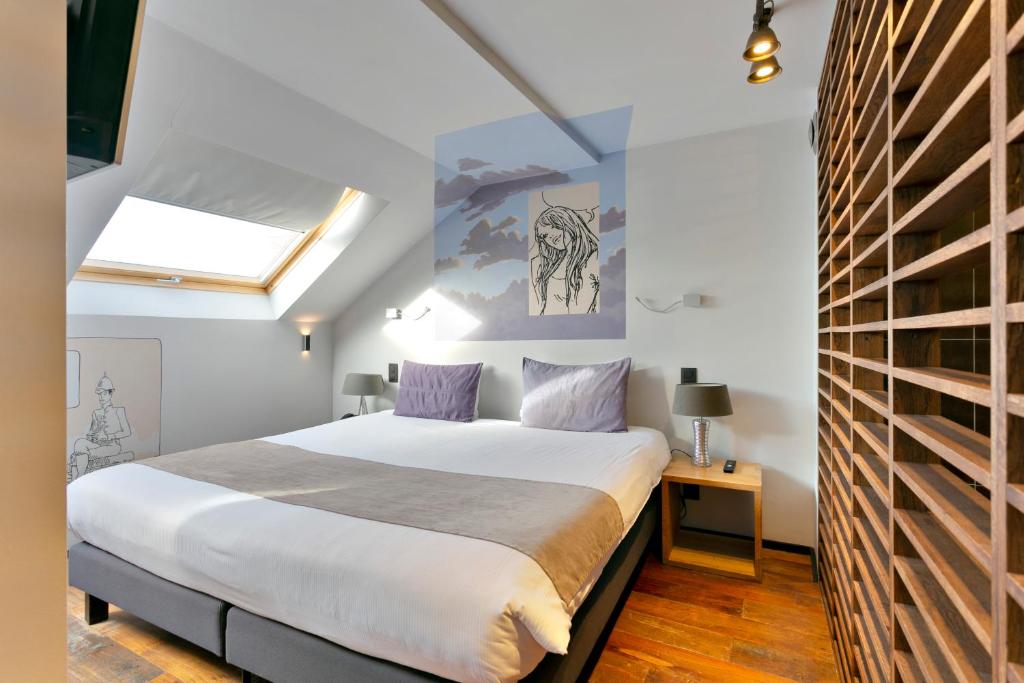 Postel nebo postele na pokoji v ubytování Boutique Hotel Saint-Géry