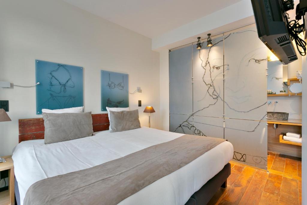 Postel nebo postele na pokoji v ubytování Boutique Hotel Saint-Géry