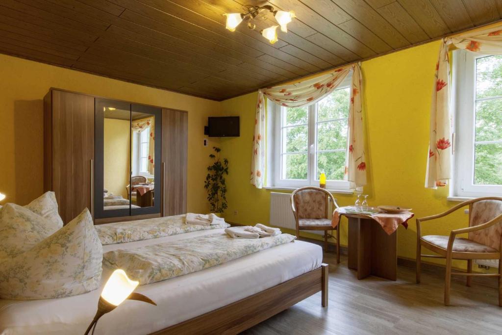 Postel nebo postele na pokoji v ubytování Kräuterbaude