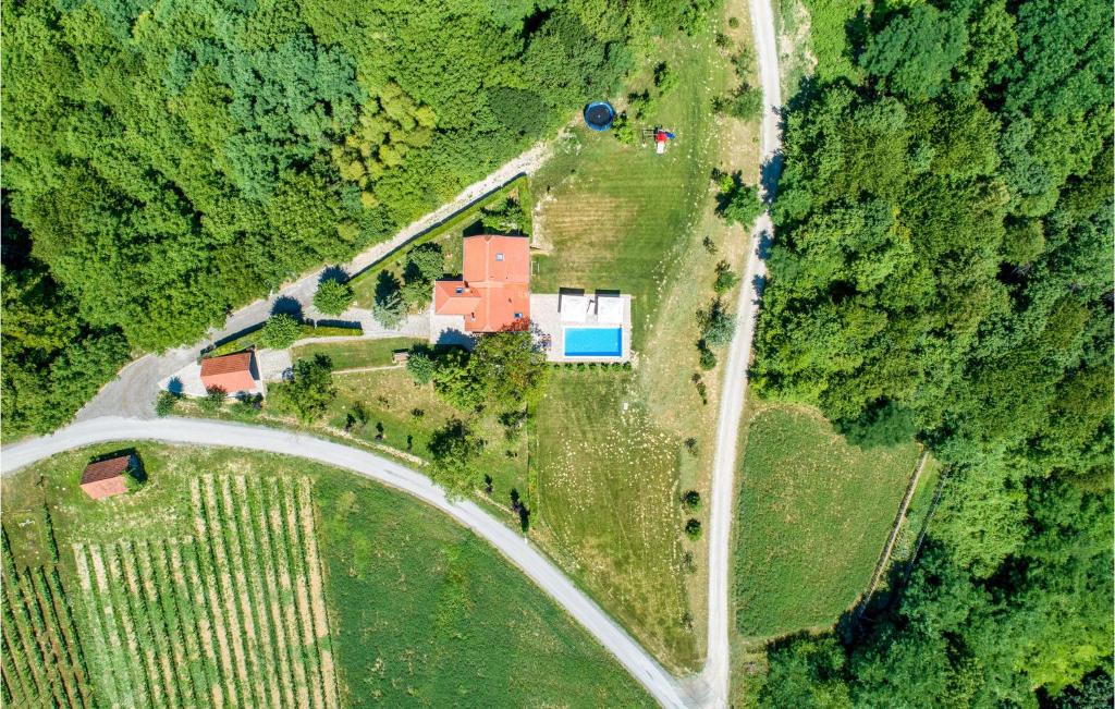 an aerial view of a house in the middle of a field at Lovely Home In Bedenica With Heated Swimming Pool in Bedenica
