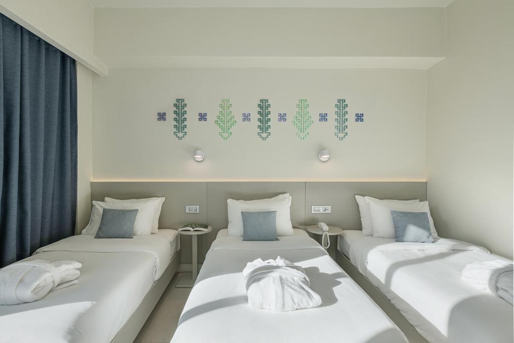 Voodi või voodid majutusasutuse Arkadi Hotel toas
