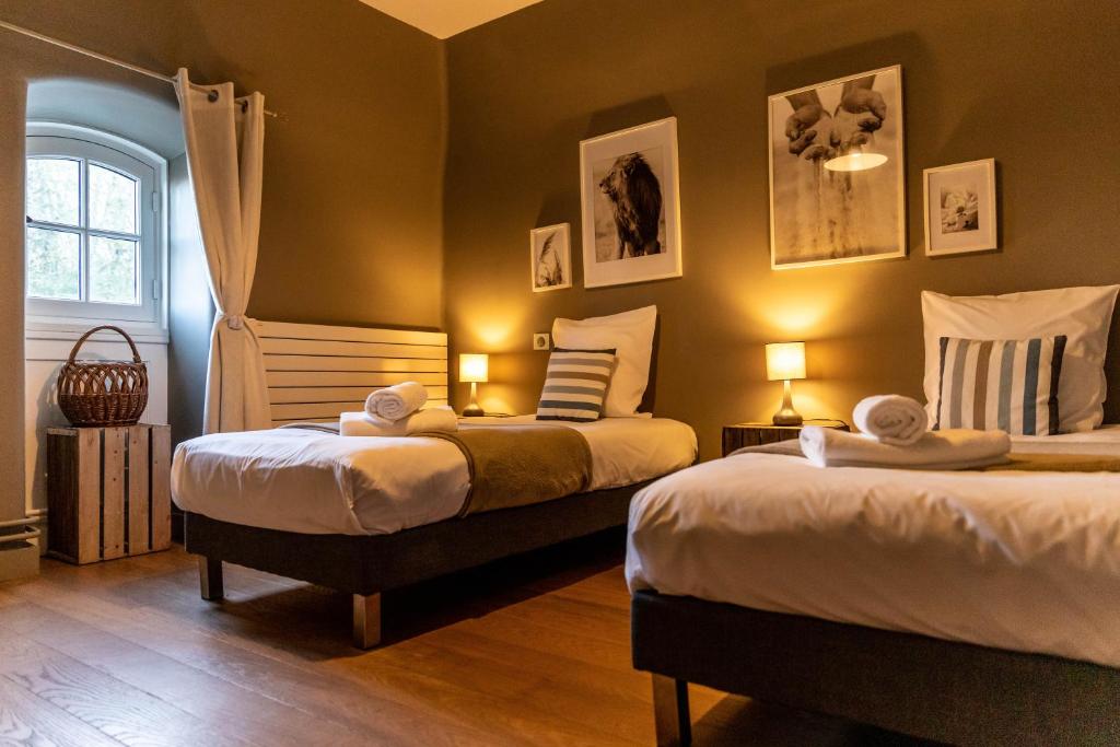 Postel nebo postele na pokoji v ubytování Hotel Ô Château