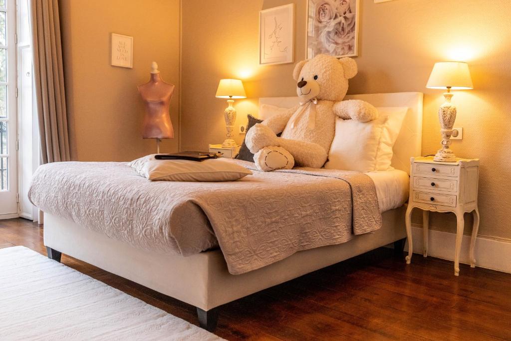 Postel nebo postele na pokoji v ubytování Hotel Ô Château