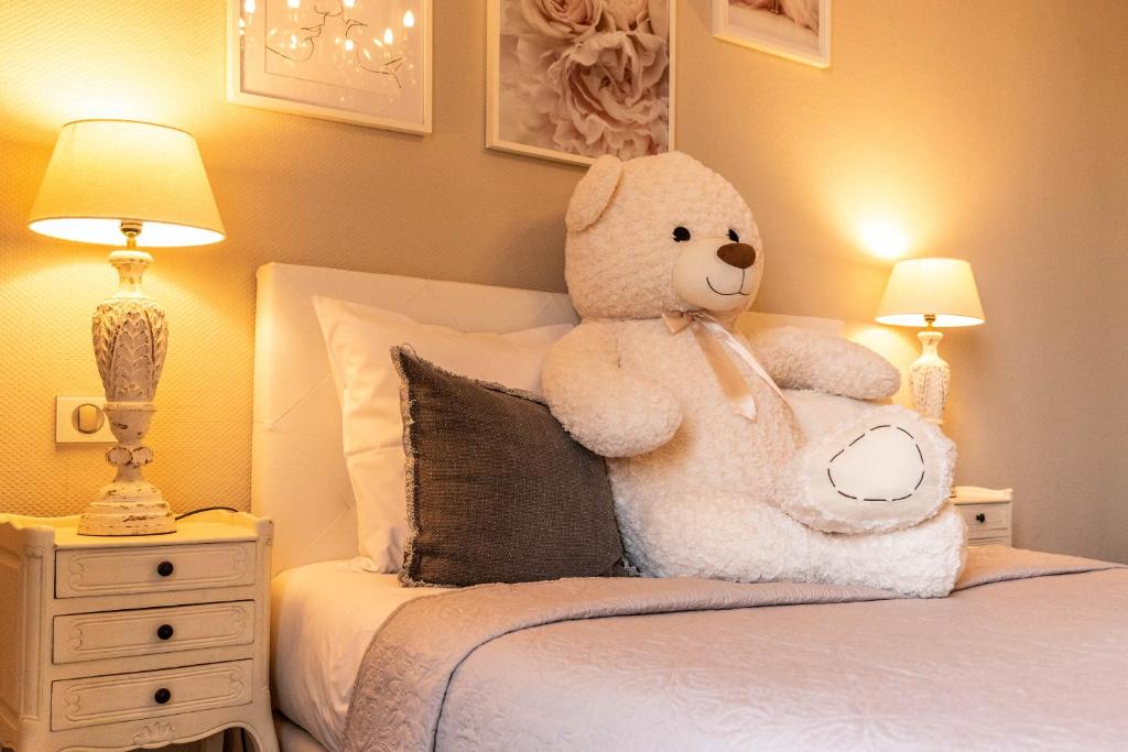 Postel nebo postele na pokoji v ubytování Hotel Ô Château