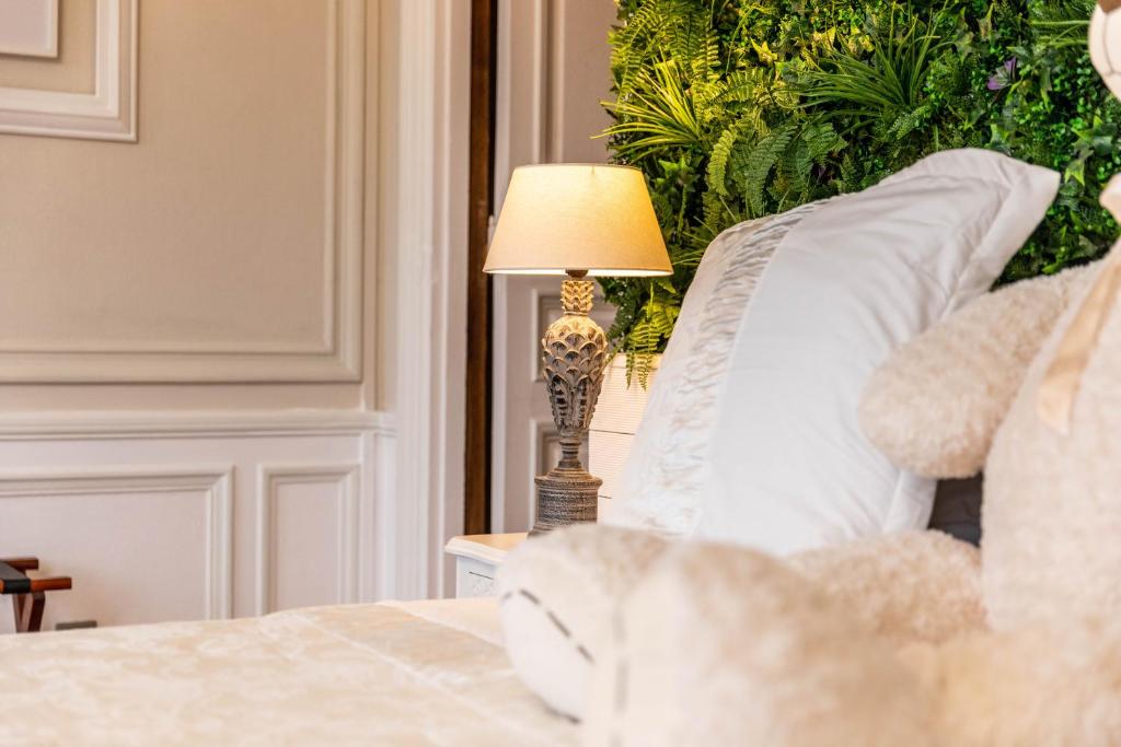 Postel nebo postele na pokoji v ubytování Hotel Ô Château