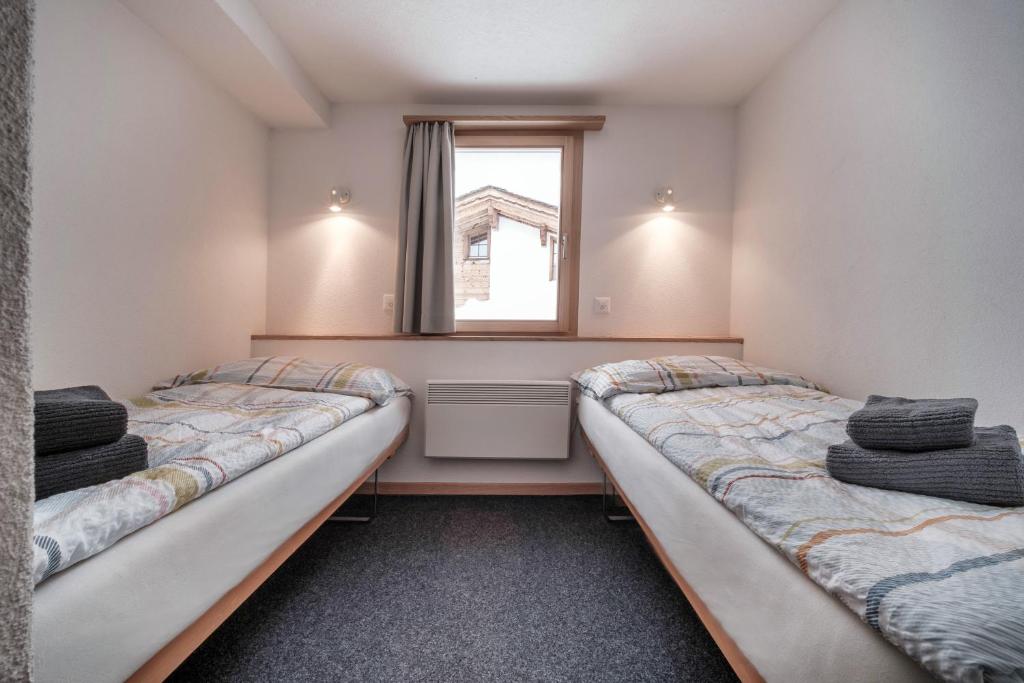Postel nebo postele na pokoji v ubytování Chalet Höckli Wohnung 2.