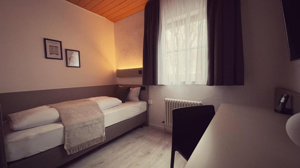Postel nebo postele na pokoji v ubytování Hotel Waldhorn