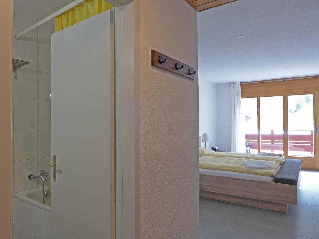 Postel nebo postele na pokoji v ubytování Apartment Eiger Residence Apt-H by Interhome