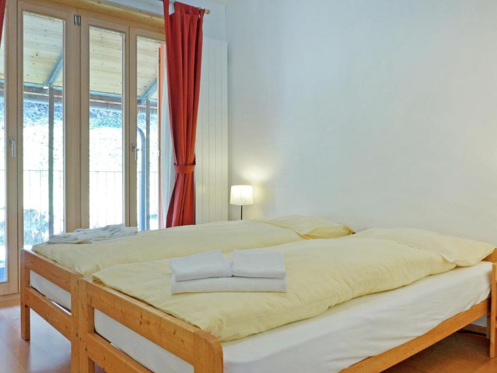 Postel nebo postele na pokoji v ubytování Apartment Schweizerheim Apt-5 by Interhome