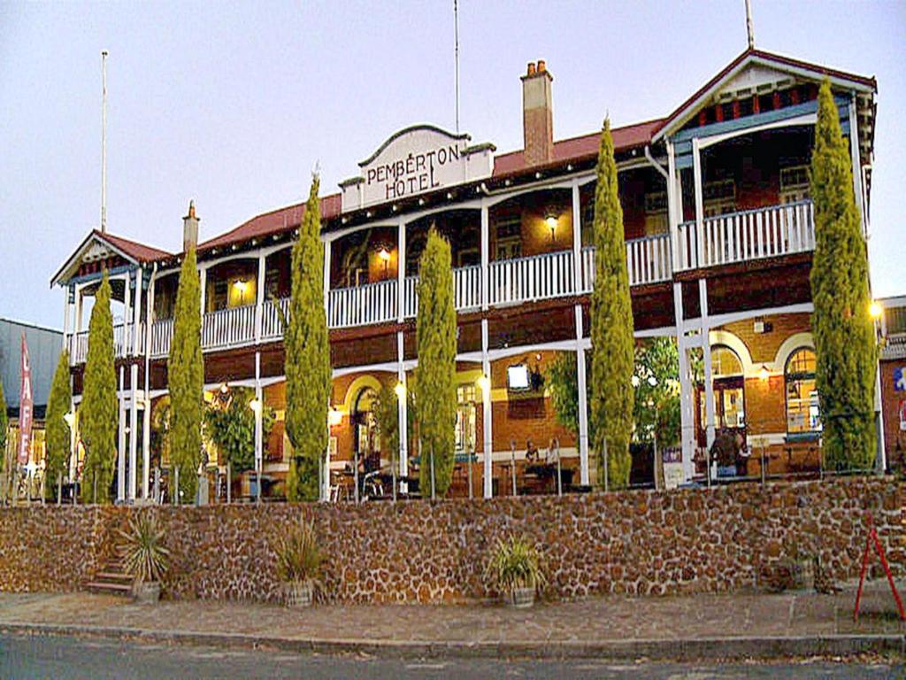 a large building with a restaurant on a street at The Pemberton Hotel in Pemberton