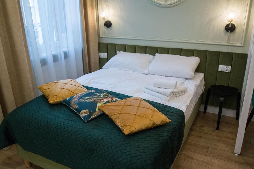 Posteľ alebo postele v izbe v ubytovaní Apartamenty u Kopernika by Rentoom