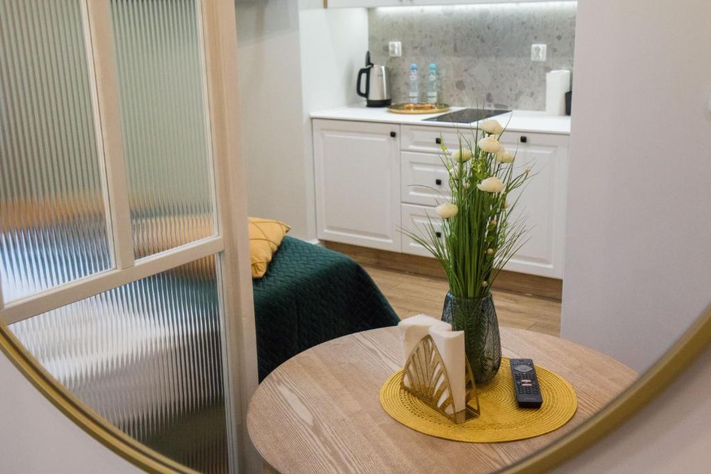Kuchyňa alebo kuchynka v ubytovaní Apartamenty u Kopernika by Rentoom