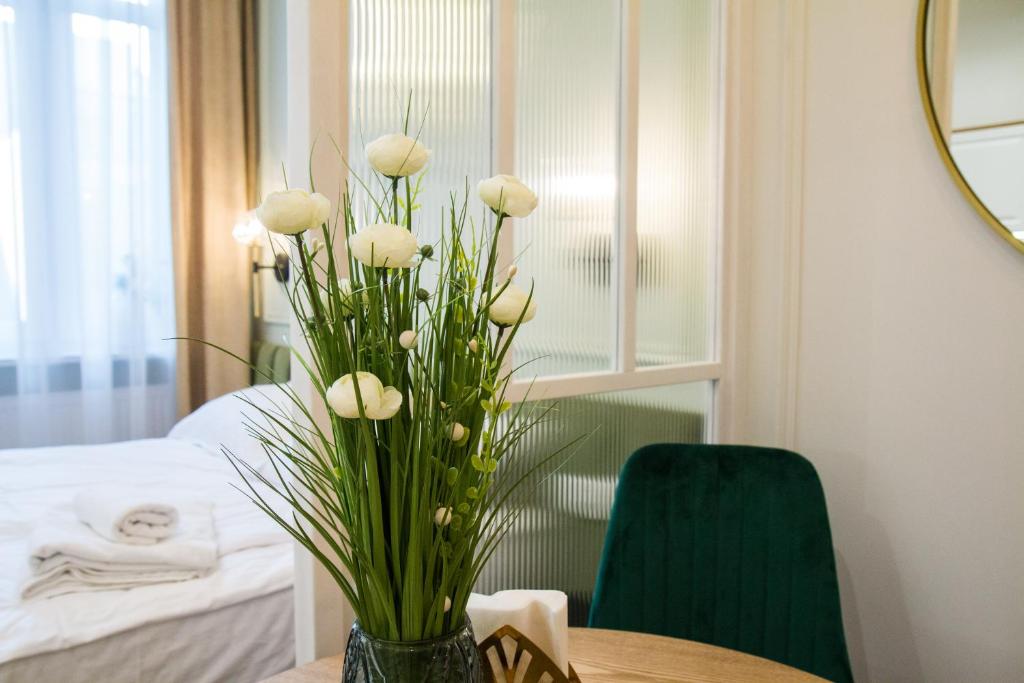 Posteľ alebo postele v izbe v ubytovaní Apartamenty u Kopernika by Rentoom