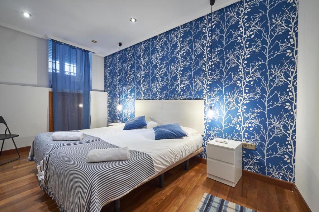 A bed or beds in a room at BV Rooms