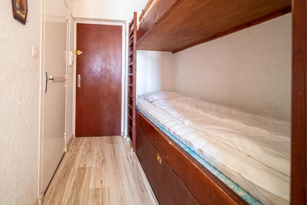 Postel nebo postele na pokoji v ubytování L'Ourson