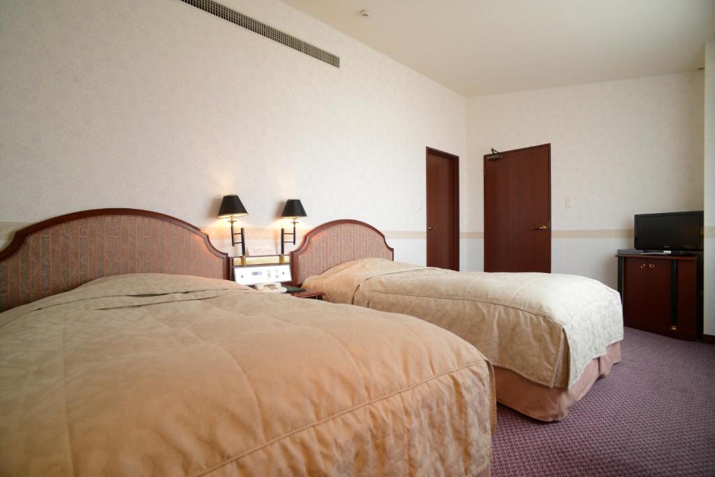 Postel nebo postele na pokoji v ubytování Hotel Bientos