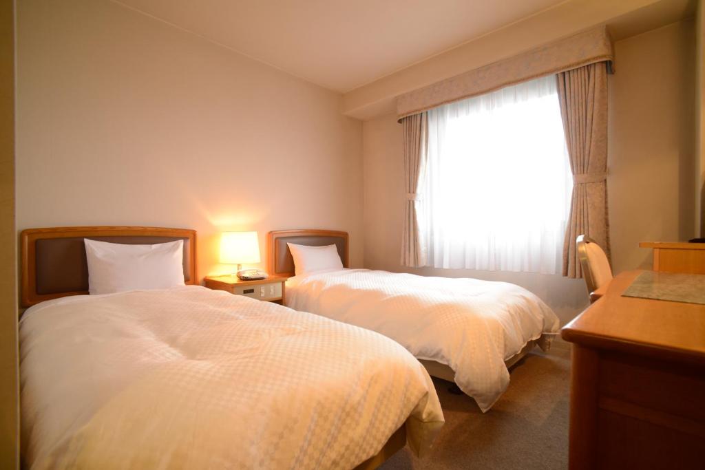 Postel nebo postele na pokoji v ubytování Hotel Bientos