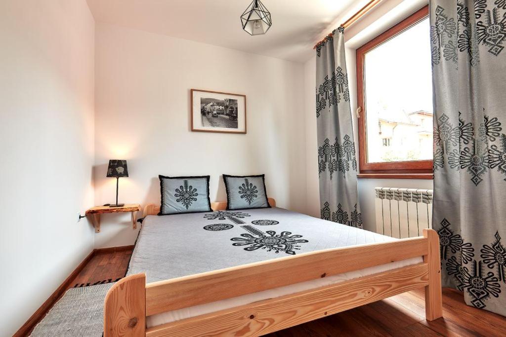 Posteľ alebo postele v izbe v ubytovaní Apartamenty Na Wilcznik Zakopane