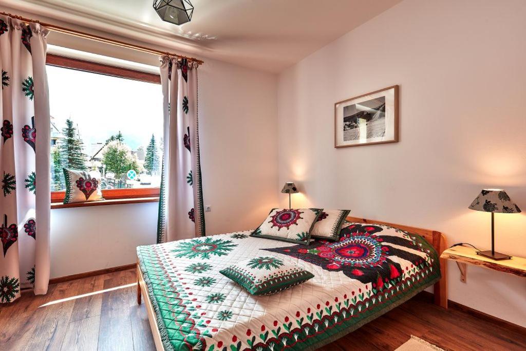 Posteľ alebo postele v izbe v ubytovaní Apartamenty Na Wilcznik Zakopane