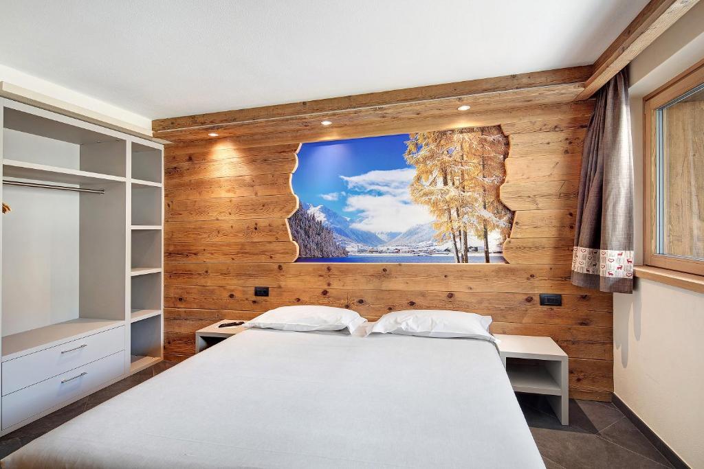 Posteľ alebo postele v izbe v ubytovaní Rasia Residence Relax Lake