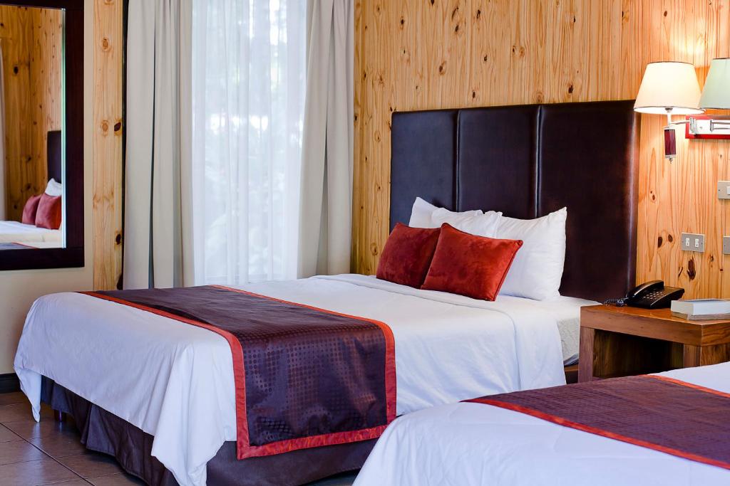 Postel nebo postele na pokoji v ubytování Hotel Savegre