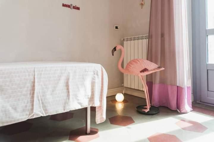 Postel nebo postele na pokoji v ubytování Casa Dani&Swing Bed&Books