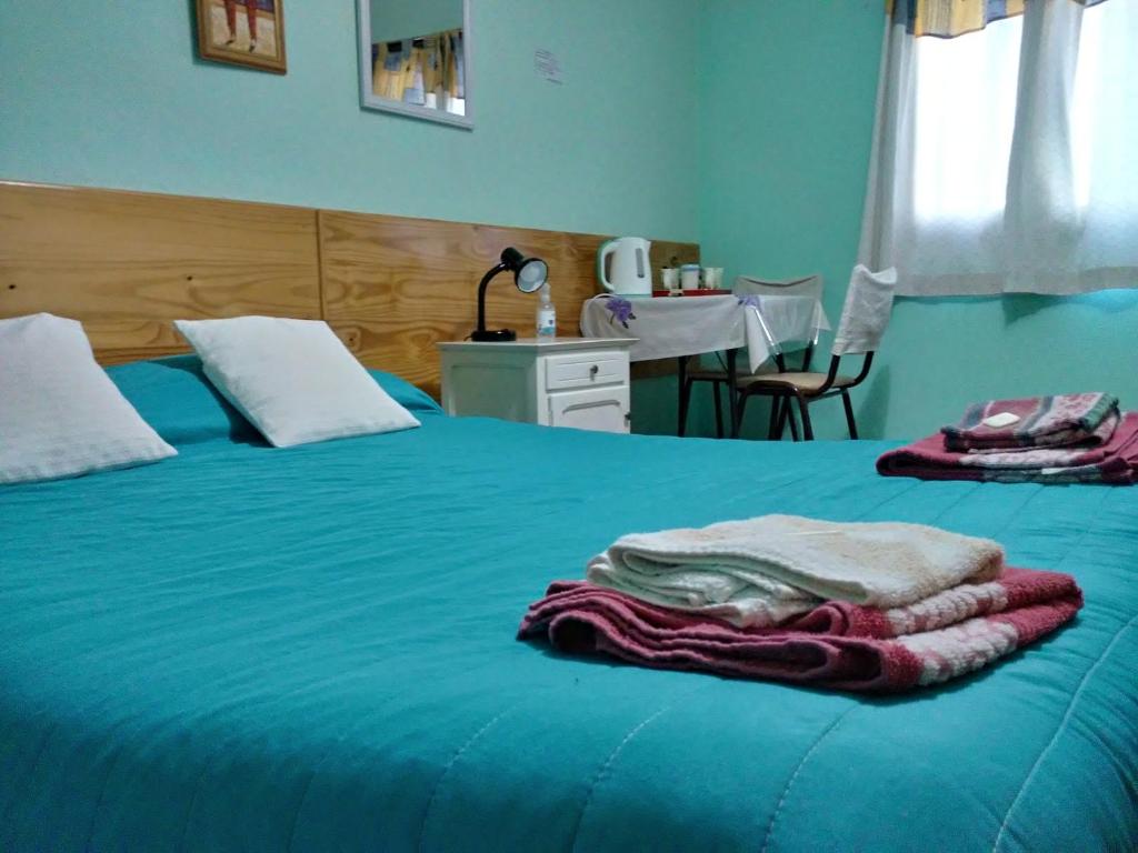 Postel nebo postele na pokoji v ubytování Residencial Sissus