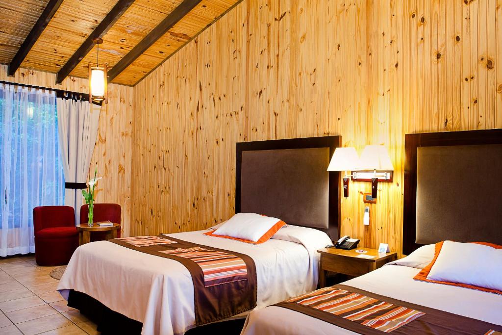 Postel nebo postele na pokoji v ubytování Hotel Savegre