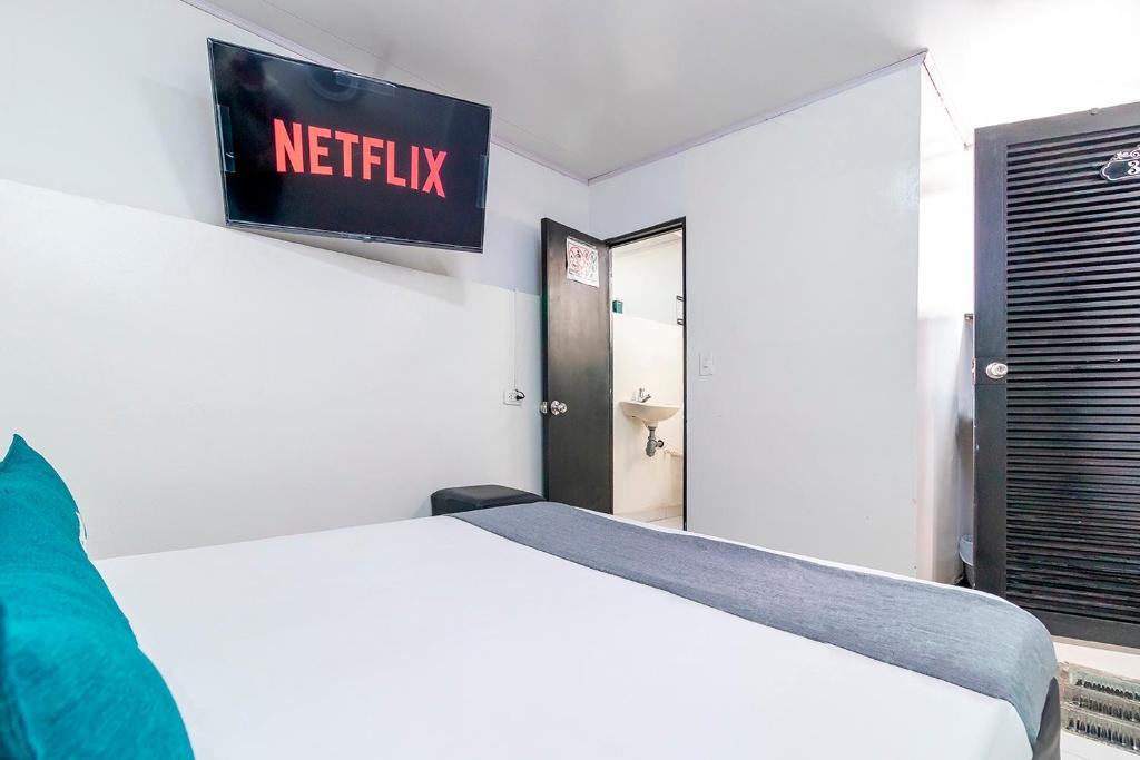 Postel nebo postele na pokoji v ubytování Hotel Bogota Home