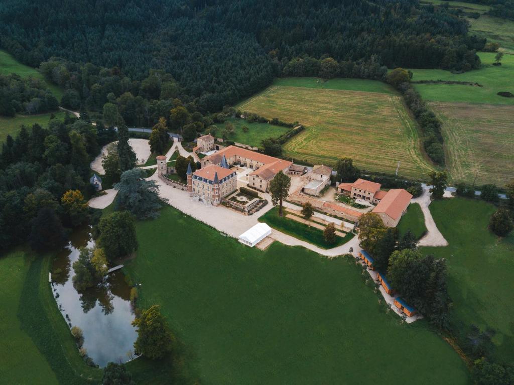 an aerial view of a large estate with a house at Domaine et Château de Valinches in Marols