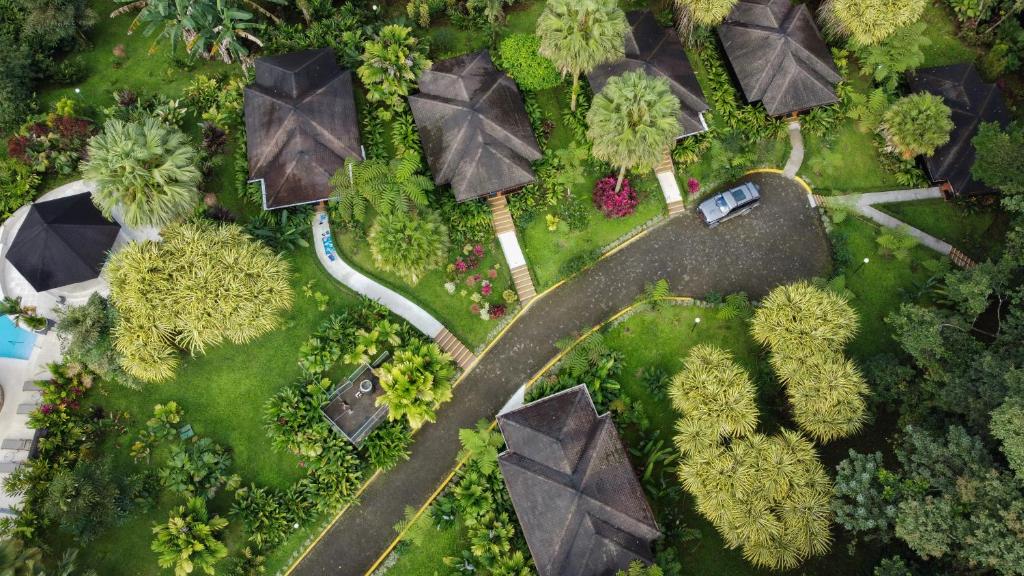 an overhead view of a park with trees and a road at Hotel Lomas del Volcan in Fortuna