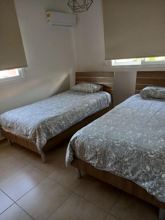 Postel nebo postele na pokoji v ubytování Mythical Sands Resort - Maria