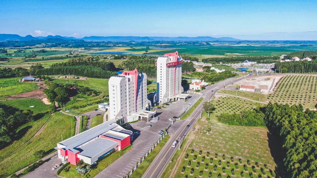 an aerial view of a large building with a road at Hotel Recanto Business Center in Restinga Sêca