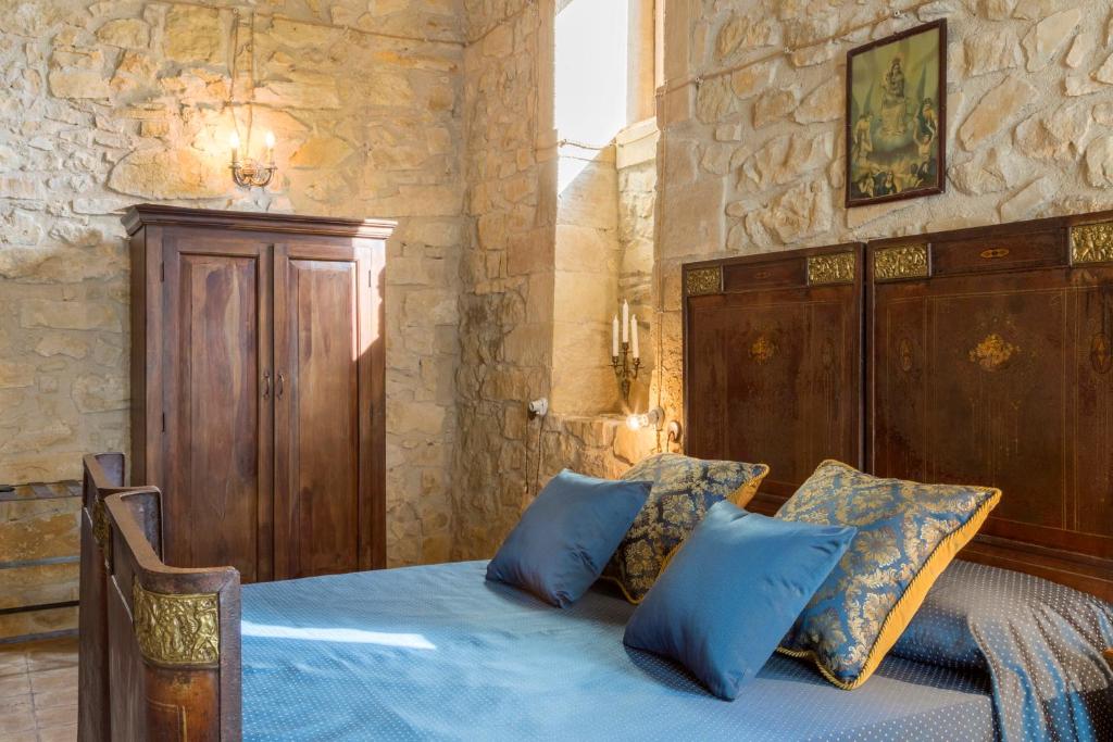 Postel nebo postele na pokoji v ubytování Masseria Fortificata Lo Zafferaneto