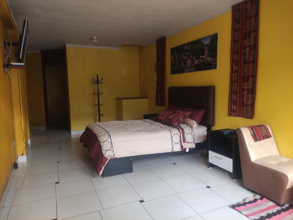 Postel nebo postele na pokoji v ubytování Casa Sucre Ayacucho