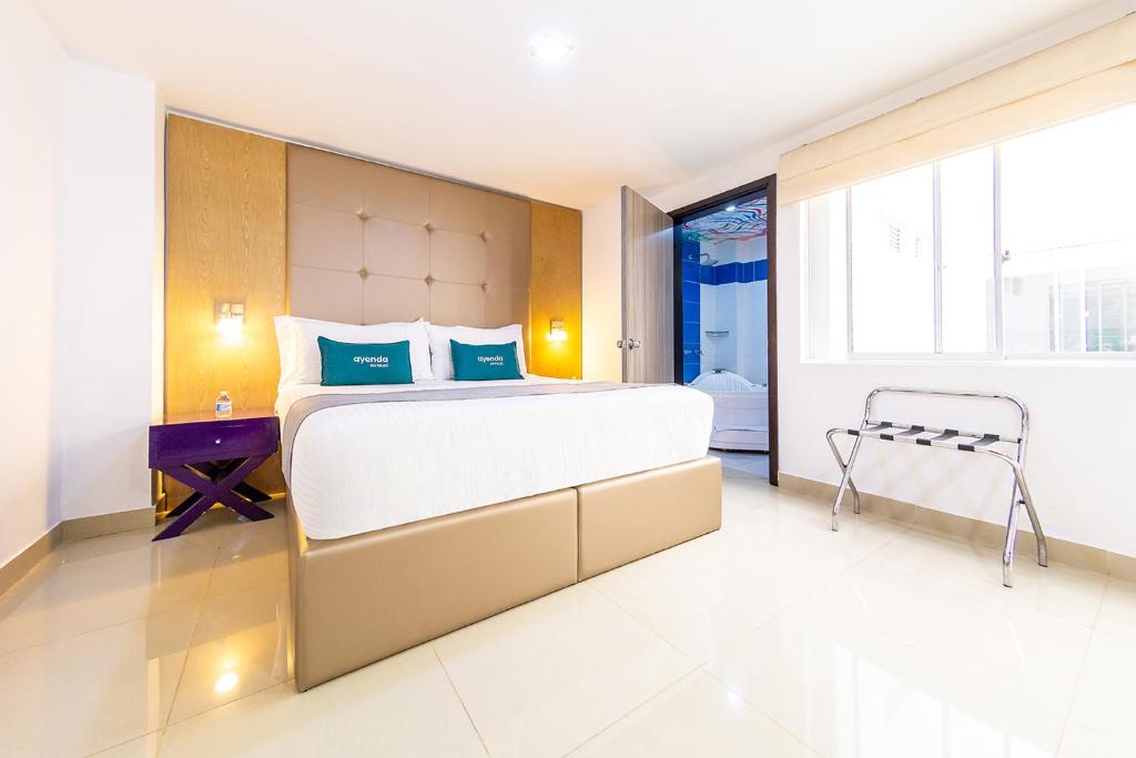 Postel nebo postele na pokoji v ubytování Hotel MH Pereira