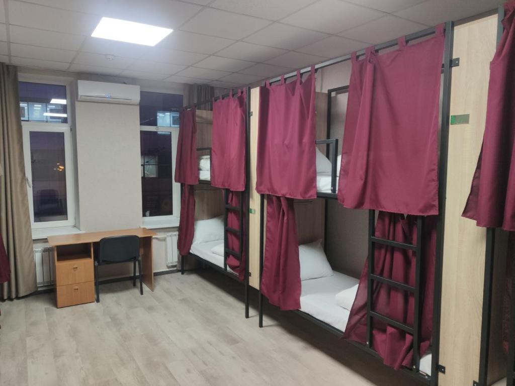 Postel nebo postele na pokoji v ubytování STAR CITY Hostel