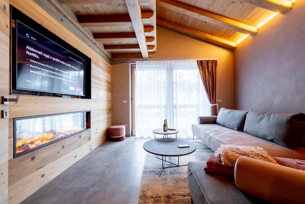 TV o dispositivi per l'intrattenimento presso Chalet Imbosc'ché - 5 beautiful rooms in charming B&B