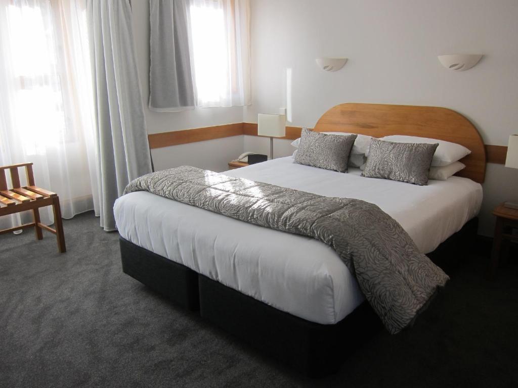 Postel nebo postele na pokoji v ubytování Amross Motel