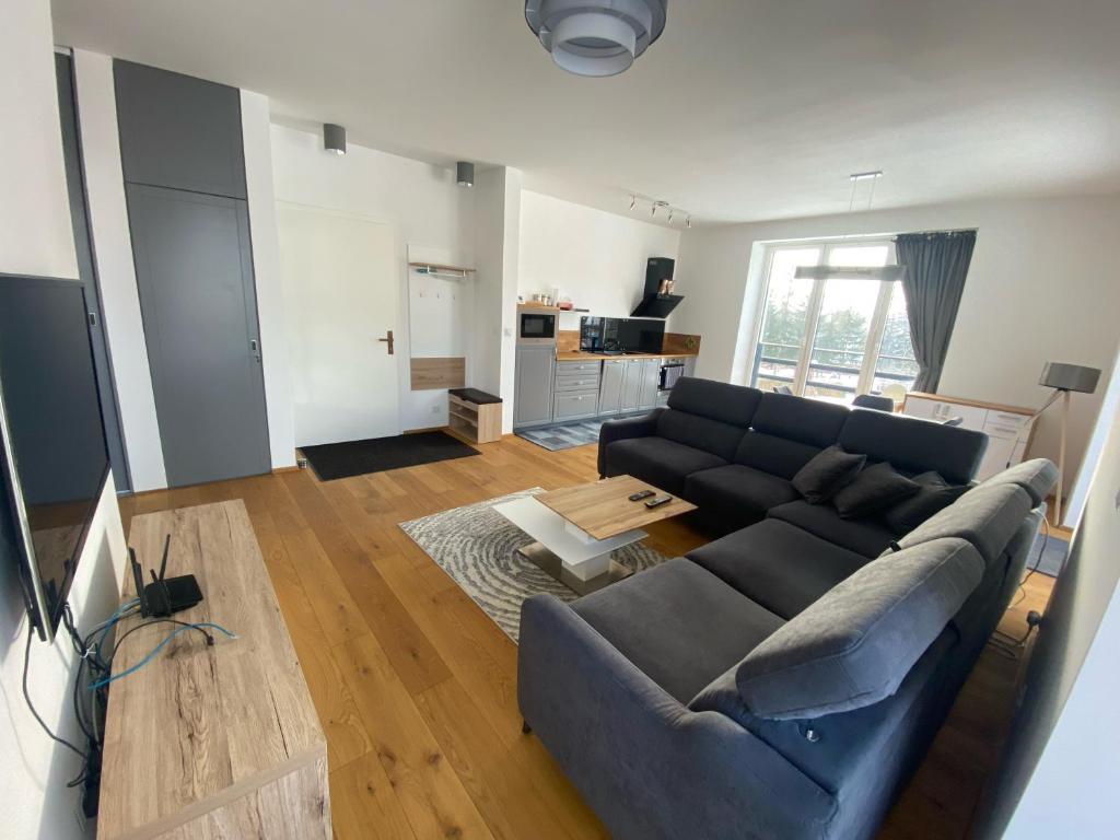 3 Sosny Apartments - Suite 1 tesisinde bir oturma alanı