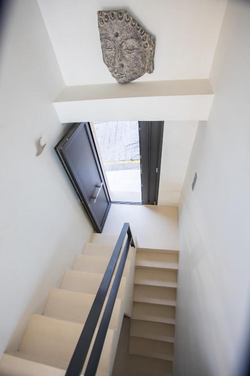 a staircase in a house with a window at Raise Spetses Sea View Villa in Spetses