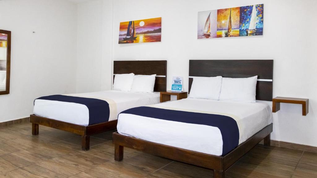 Postel nebo postele na pokoji v ubytování José y Glendy Hotel