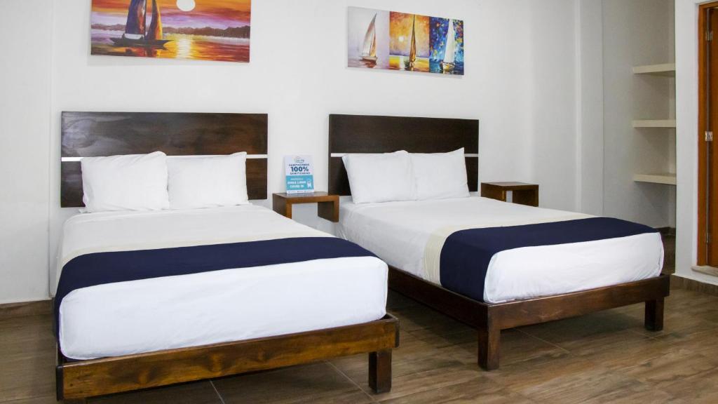 Postel nebo postele na pokoji v ubytování José y Glendy Hotel